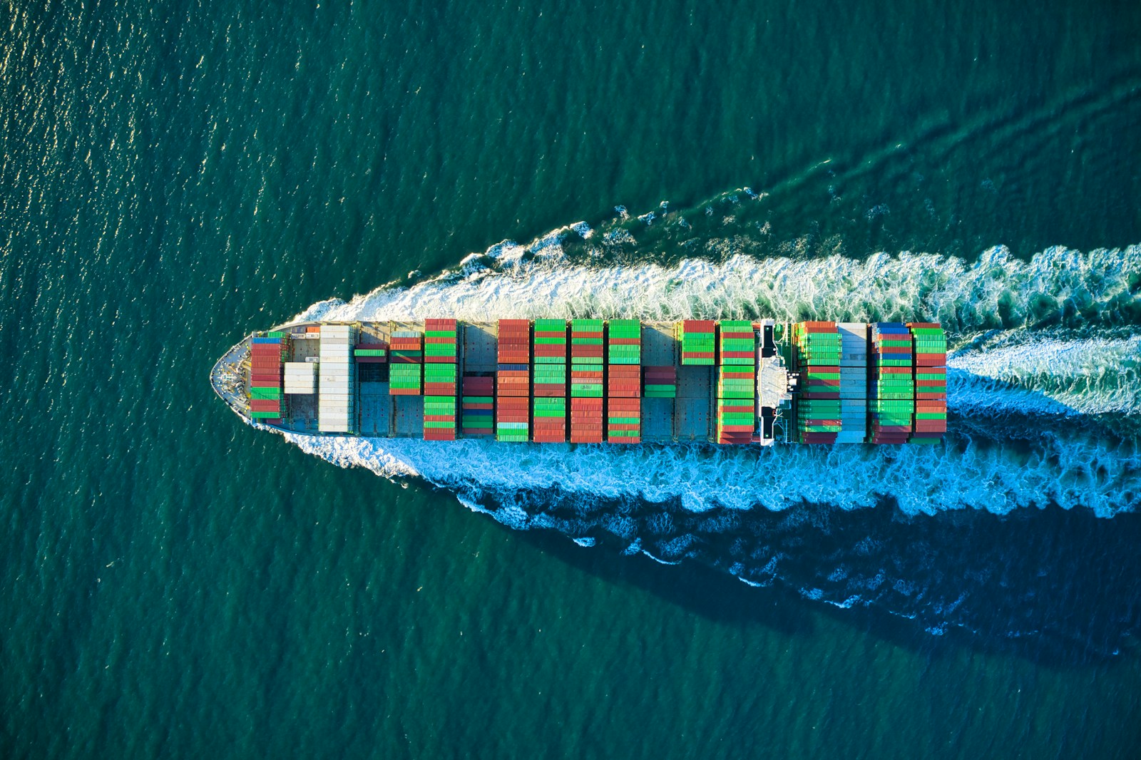 Cargo vessel at sea representing international commercial execution